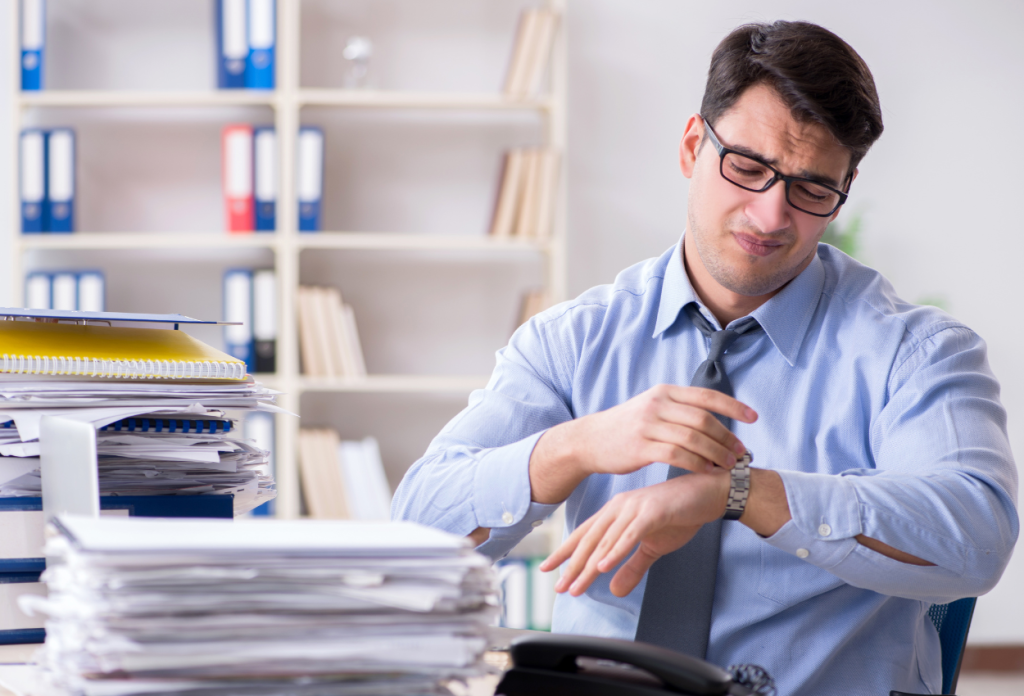 a busy professional working on his workspace