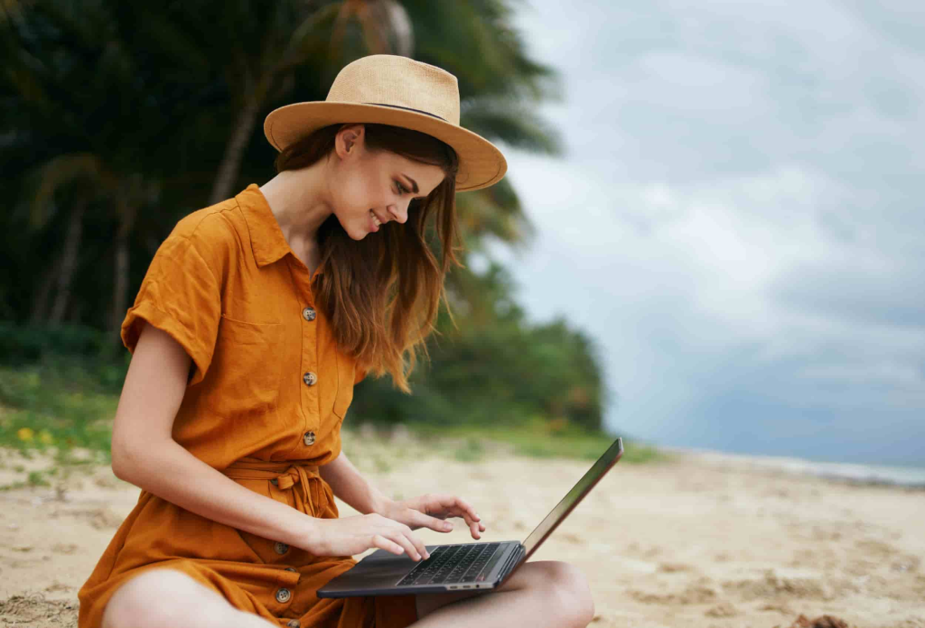 a digital nomad with her laptop while on vacation 